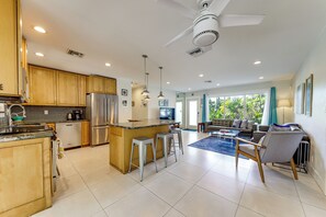 A modern kitchen with a central island, stainless steel appliances, and pendant lighting. - Oakland Park Vacation Rental w/ Private Pool! (Oakland Park)