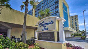 The Oceanside Inn sign with a clear view of the building's exterior, including the name and welcoming message. - Beachfront Daytona Studio, Close to Parks! (Daytona Beach Shores)