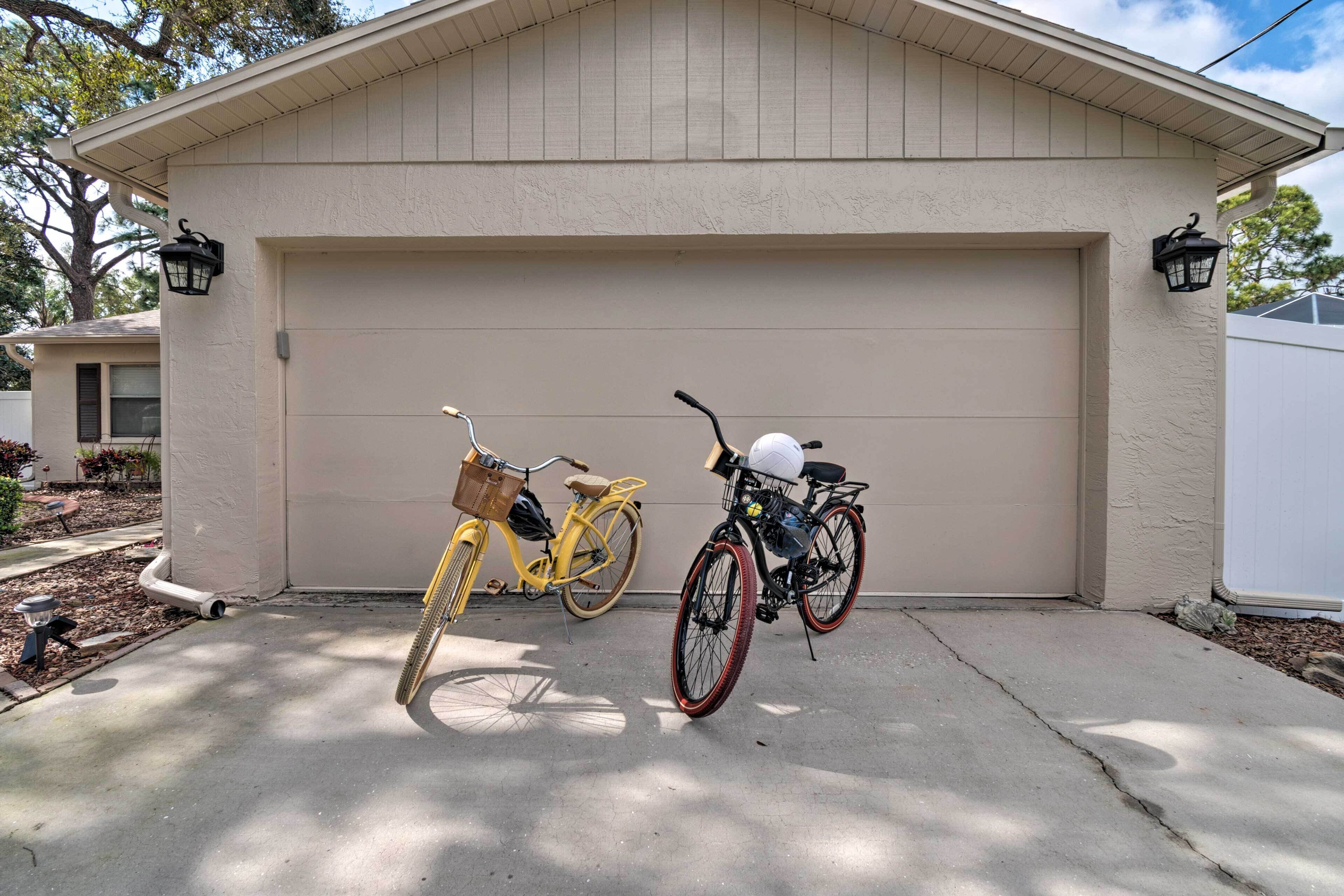 A garage with two bicycles parked in front.