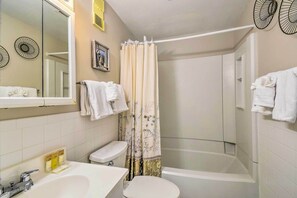 A bathroom with a sink, toilet, and bathtub. - Homey Myrtle Beach Condo w/ Resort Amenities! (Myrtle Beach)