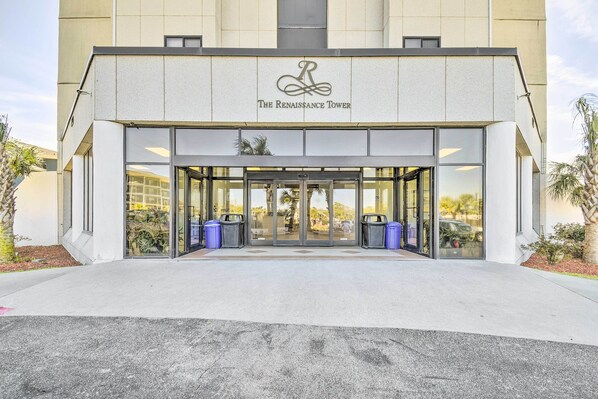 Welcome to The Renaissance Tower, featuring a striking entrance with a clear view into the interior.