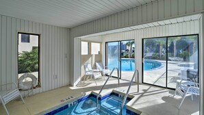 A pool area with a clear view of the pool, a lifeguard chair, and a set of stairs leading into the pool. - Walk to Family Kingdom: Retreat w/ Pool (Myrtle Beach)