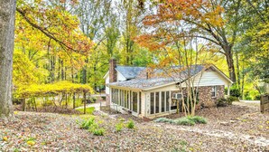 A house surrounded by trees with autumn leaves. - Lovely Taylors Home: 8 Mi to Dtwn Greenville! (Taylors)
