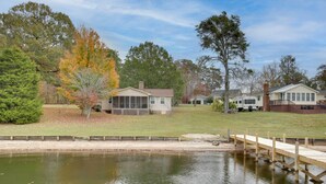 A residential area with a house, a dock, and a pond. - Lakefront House w/ Boat Ramp, Dock & Sunset Views! (Cross Hill)