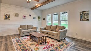 Living area - Modern Waterfront Home w/ Dock on Lake Bowen! (Inman)