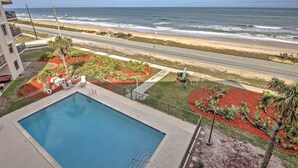 A pool with a view of the beach and ocean. - Oceanfront Ormond Beach Condo w/ Pool Access! (Ormond Beach)