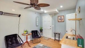 A compact kitchen with a wooden countertop, a sink, and a ceiling fan. - Saint Helena Island Getaway w/ Marsh Views! (Saint Helena Island)