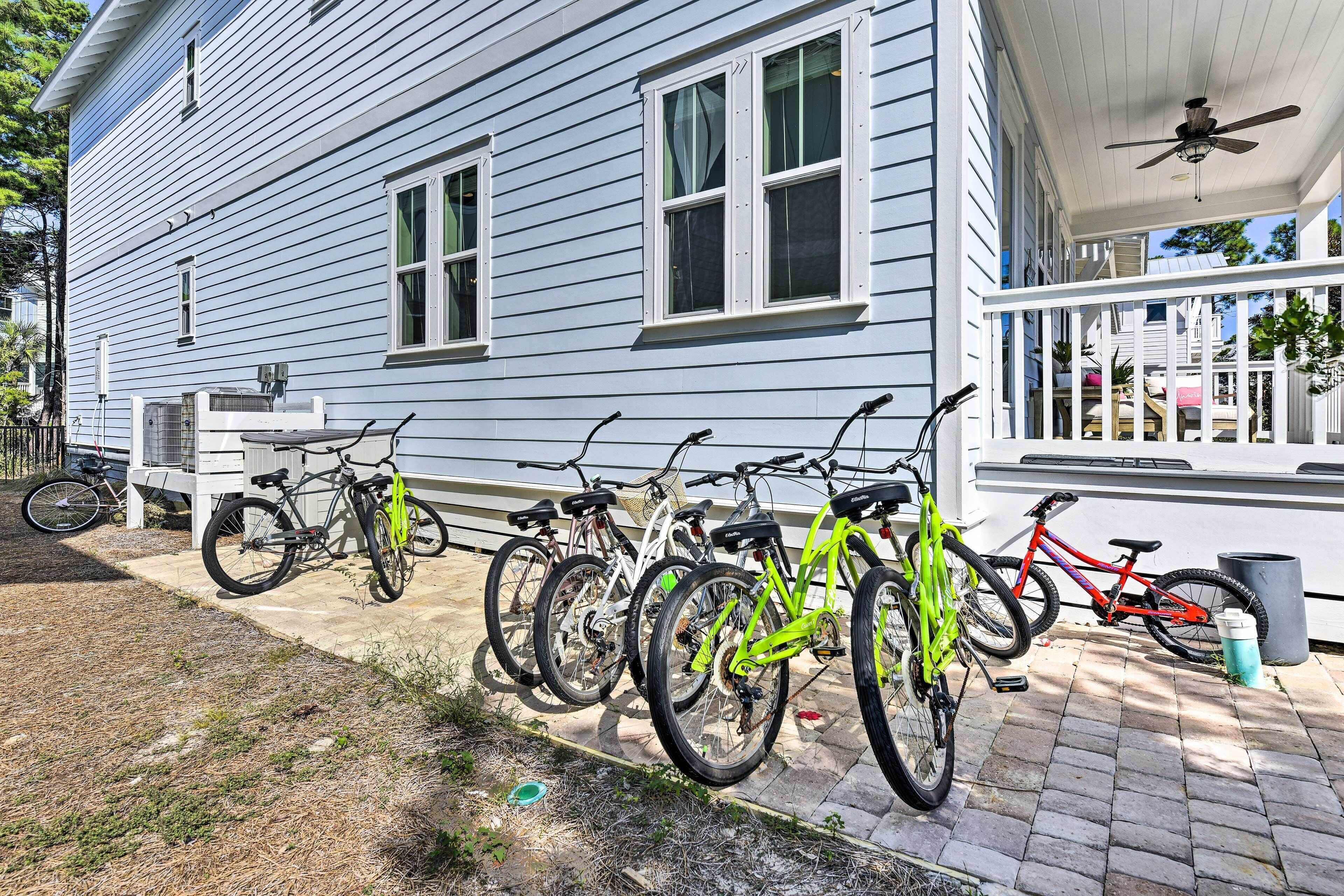 A house with a porch and a row of bicycles parked outside.