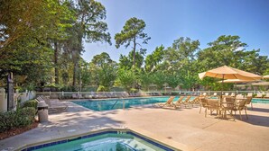 A pool area with lounge chairs, umbrellas, and a sign indicating a depth of 3 feet. - 2 Blocks to Beach: Hilton Head Condo, Pool, Tennis (Hilton Head Island)