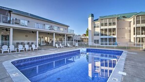 A swimming pool area with lounge chairs and a covered seating area. - Branson Condo w/ Pool: 2 Mi to Table Rock Lake (Branson)