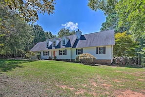 A two-story house with a sloped roof, a front porch, and a well-maintained lawn. - 2 Mi to Clemson: Central Villa w/ Deck, Near Lakes (Clemson)