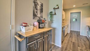 A kitchen with a wooden countertop, a coffee maker, and a sign that reads "Life is Brew-tiful." - Cheerful Condo: Patio, 2 Mi to Branson Strip! (Branson)