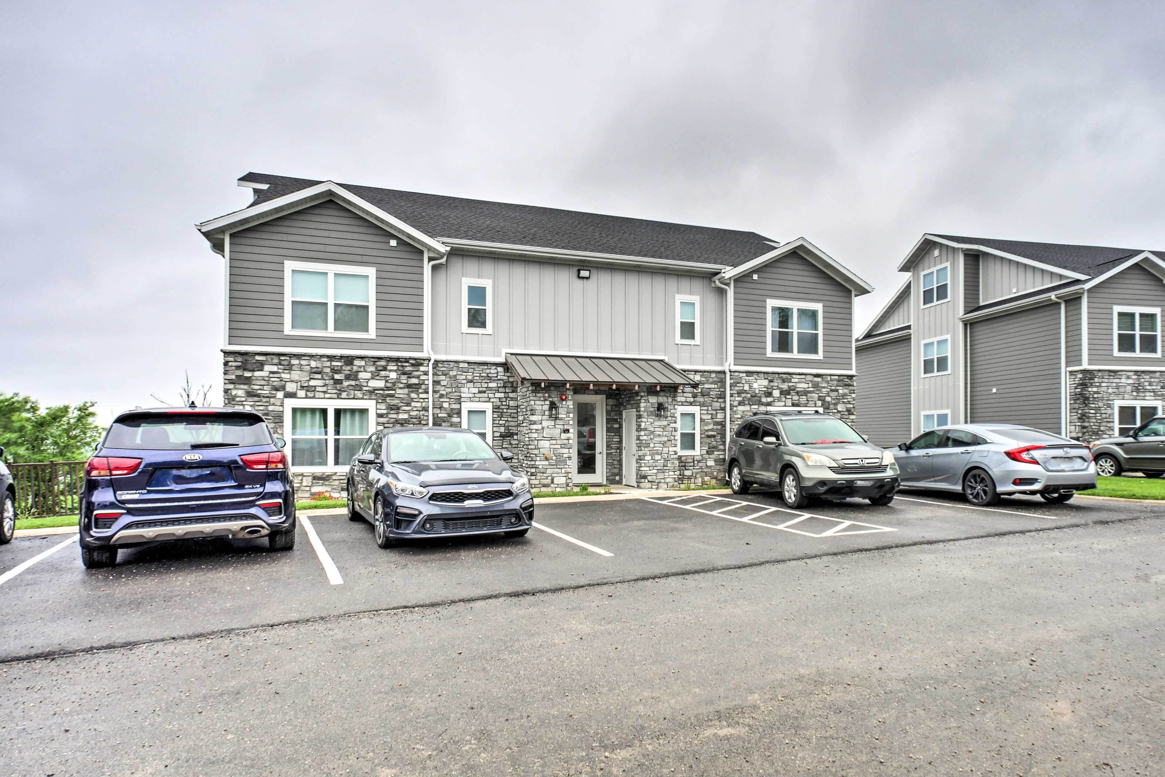 A multi-story building with a parking lot.