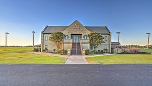 A large building with a prominent entrance, a sign reading "LEGENDS The Classic Swing Golf School," and a well-maintained lawn in front. - 10 Mi to Beach: Legends Resort Condo on Ninth Hole (Myrtle Beach)