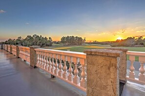 A balcony with a view of a golf course at sunset. - 10 Mi to Beach: Legends Resort Condo on Ninth Hole (Myrtle Beach)