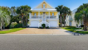 A two-story house with a front porch, a staircase, and a driveway. - 1 Mi to Beach + Hot Tub: Murrells Inlet Retreat! (Murrells Inlet)