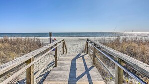 A wooden boardwalk leading to a beach with a clear sky. - 1 Mi to Beach + Hot Tub: Murrells Inlet Retreat! (Murrells Inlet)