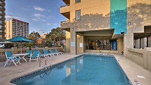 A swimming pool with lounge chairs and a sign indicating no diving is allowed. - Walk to Ocean: Myrtle Beach Condo w/ Views! (Myrtle Beach)