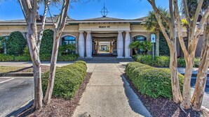 A building with a sign reading "BEACH FIT" and a wheelchair accessibility symbol. - Resort Perks & Pools: Townhome By Barefoot Landing (Myrtle Beach)