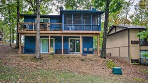 A two-story house with a balcony, a covered porch, and a small shed. - Furnished Deck! Golfer's Oasis in Margaritaville (Osage Beach)