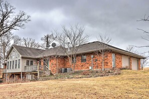 Stroll out to the covered porch and enjoy the serene surroundings from this two-story home.