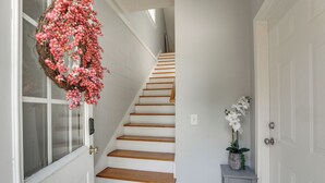 A staircase with wooden steps and white walls. - 4 Mi to Dtwn: Simplistic Summerville Studio (Summerville)