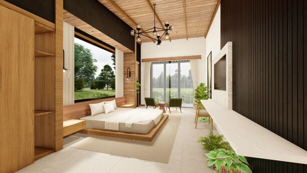 A modern bedroom with a large bed, a desk, and a view of greenery. - Best Villa (La Fortuna)