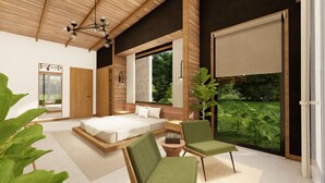 A modern bedroom with a large bed, a sitting area with chairs, a view of greenery through large windows, and a wooden ceiling. - Best Villa (La Fortuna)