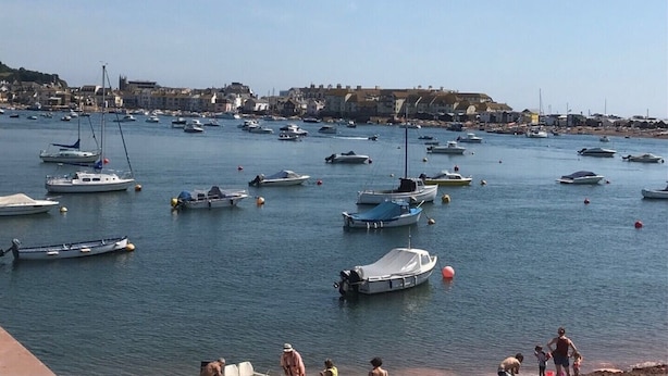 A marina with numerous boats docked, a waterfront promenade, and buildings in the background. - Coastal retreat Converted Stables, ,  close to Maidencombe beach & pubs. (Stokeinteignhead Torquay,)