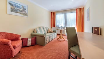 Junior Suite | Living area | 30-inch TV with satellite channels