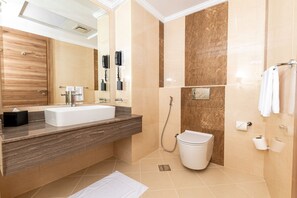 Shower, hair dryer, slippers, towels