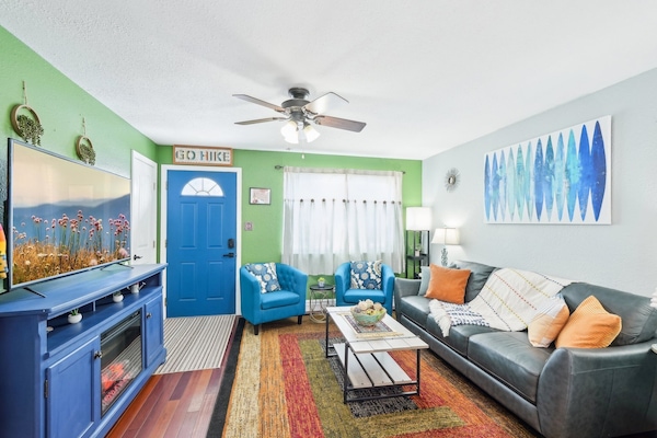 Welcome to our home! Enjoy the artsy, colorful, boho living room