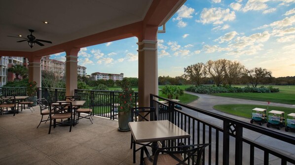 Enjoy dining and socializing in this outdoor space with a golf course view.