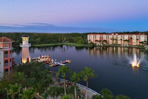 Enjoy waterfront views from the hotel's modern building with multiple balconies overlooking the lake.