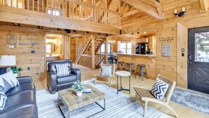 A spacious wooden cabin interior with a living area, a dining area, and a kitchen. - 1 Mi to Slopes! Family-friendly Massanutten Cabin (McGaheysville)