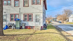 A two-story house with a front porch, a barbecue grill, and a small shed. - Dtwn Family Home 2 Mi to Indiana Convention Center (Indianapolis)