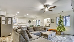 A modern living room with a sectional sofa, a coffee table, and a ceiling fan. - Family Getaway < 2 Mi to Massanutten Ski Lodge! (McGaheysville)