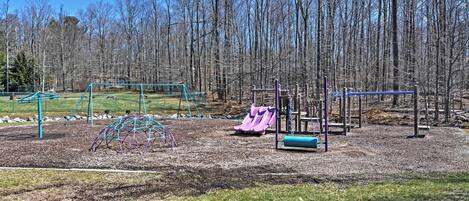 A playground with swings, slides, and climbing structures.