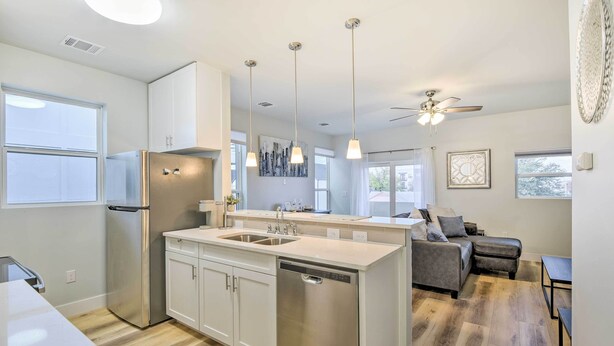 A modern kitchen with a central island, stainless steel appliances, and pendant lighting. - Walk to Tcu: Fort Worth Retreat w/ Balcony! (Fort Worth)