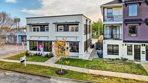 A modern two-story building with a flat roof and large windows. - Walk to Tcu: Fort Worth Retreat w/ Balcony! (Fort Worth)