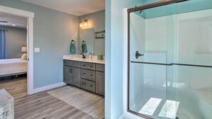A modern bathroom with a glass shower enclosure, a sink with a mirror, and a vanity with drawers. - Lampe Retreat w/ Pool Access - Walk to Lake! (Lampe)