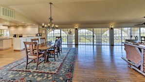 A spacious kitchen with a dining area, large windows, and a ceiling fan. - Working Vineyard & Private Pool: Villa in Plymouth (Plymouth)