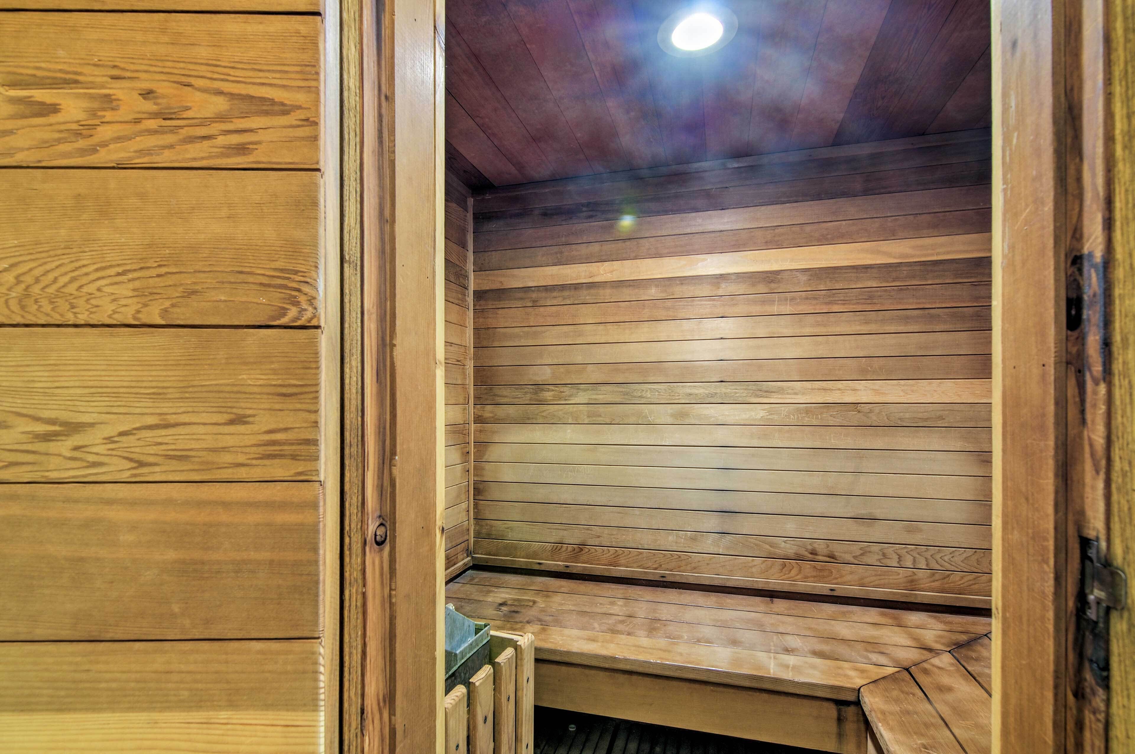 A sauna with wooden walls and benches.
