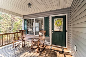 A wooden porch with a rocking chair and a table, a green door, and a window with blinds. - 'the Toasted Marshmallow' Mt Jackson Retreat! (Basye)