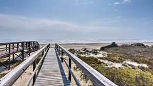 A wooden boardwalk leading to a beach with a clear sky. - Private Beach + Oceanfront Balcony: Freeport Home (Freeport)