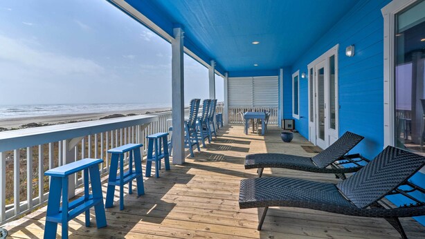 A covered deck with blue chairs and stools, overlooking the beach. - Private Beach + Oceanfront Balcony: Freeport Home (Freeport)