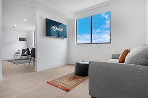 1 Bedroom w/ Den | Living area | 21-inch Smart TV with cable channels, TV