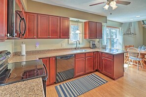 Enjoy cooking in this well-equipped kitchen with a dishwasher, double sink, and oven.
