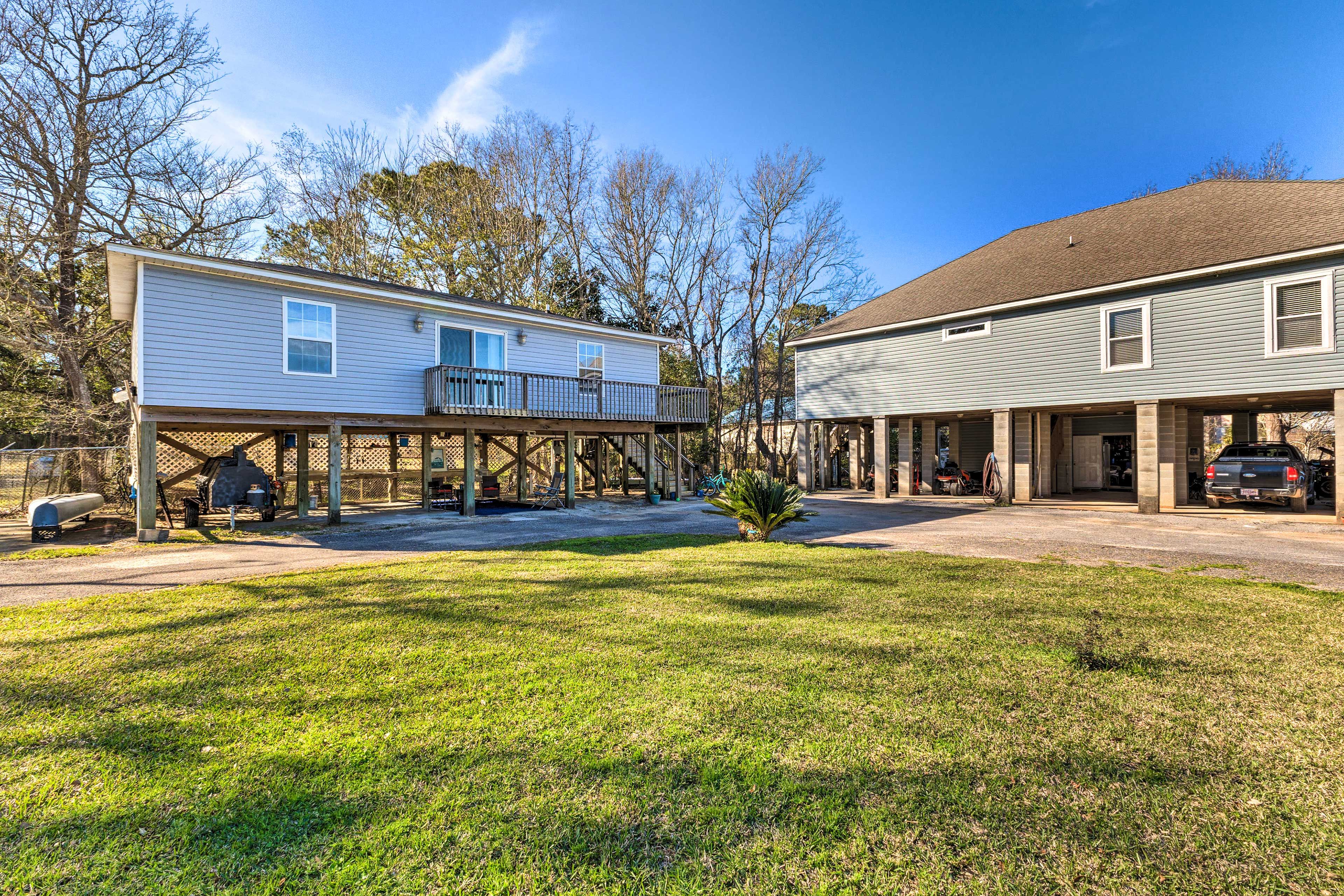 A two-story house with a covered porch and a garage.