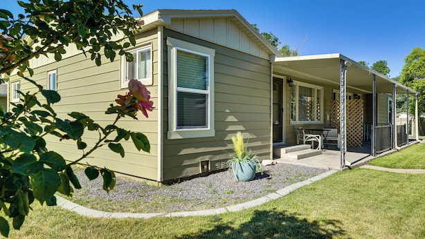 A single-story house with a covered porch, a small patio, and a potted plant. - Fruita Vacation Rental: Walk to Downtown! (Fruita)